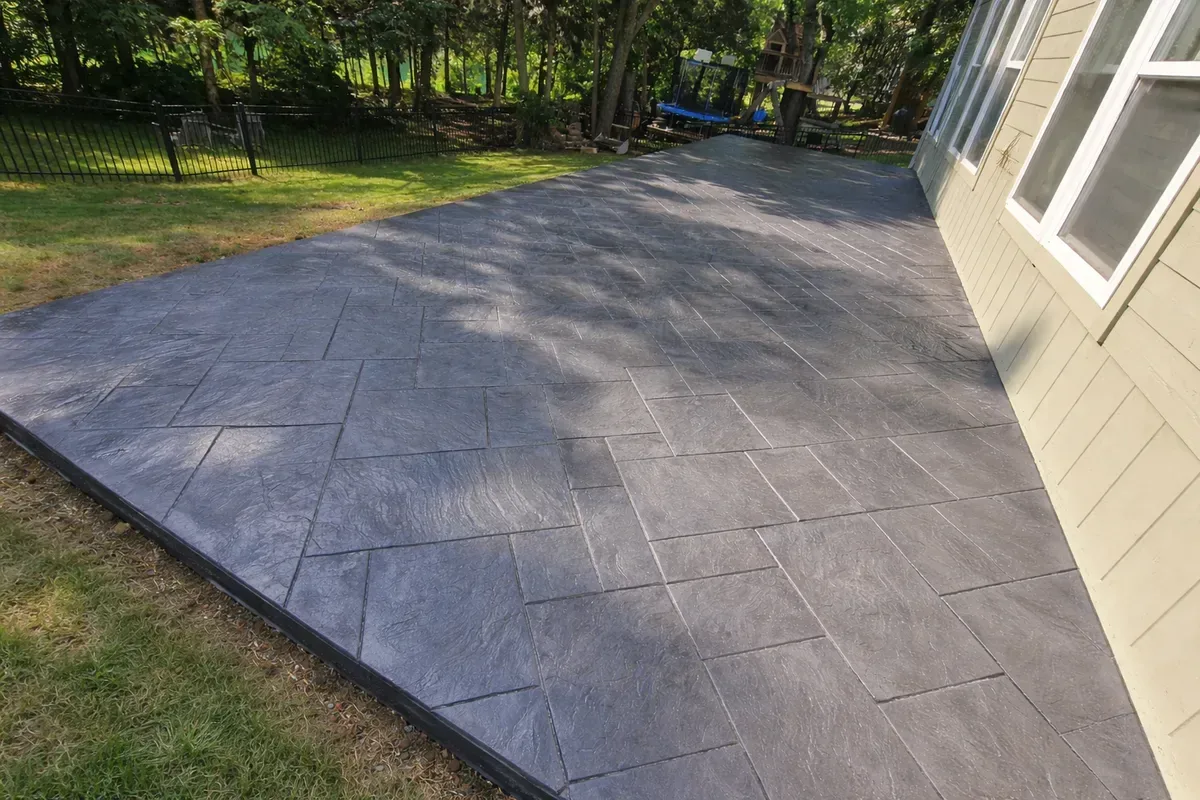 Stamped concrete patio with natural stone pattern installed by Kansas City Concrete Contractors
